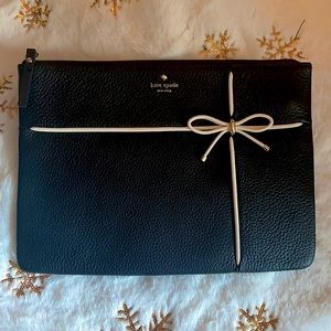 Kate Spade black clutch with white bow accent and gold hardware